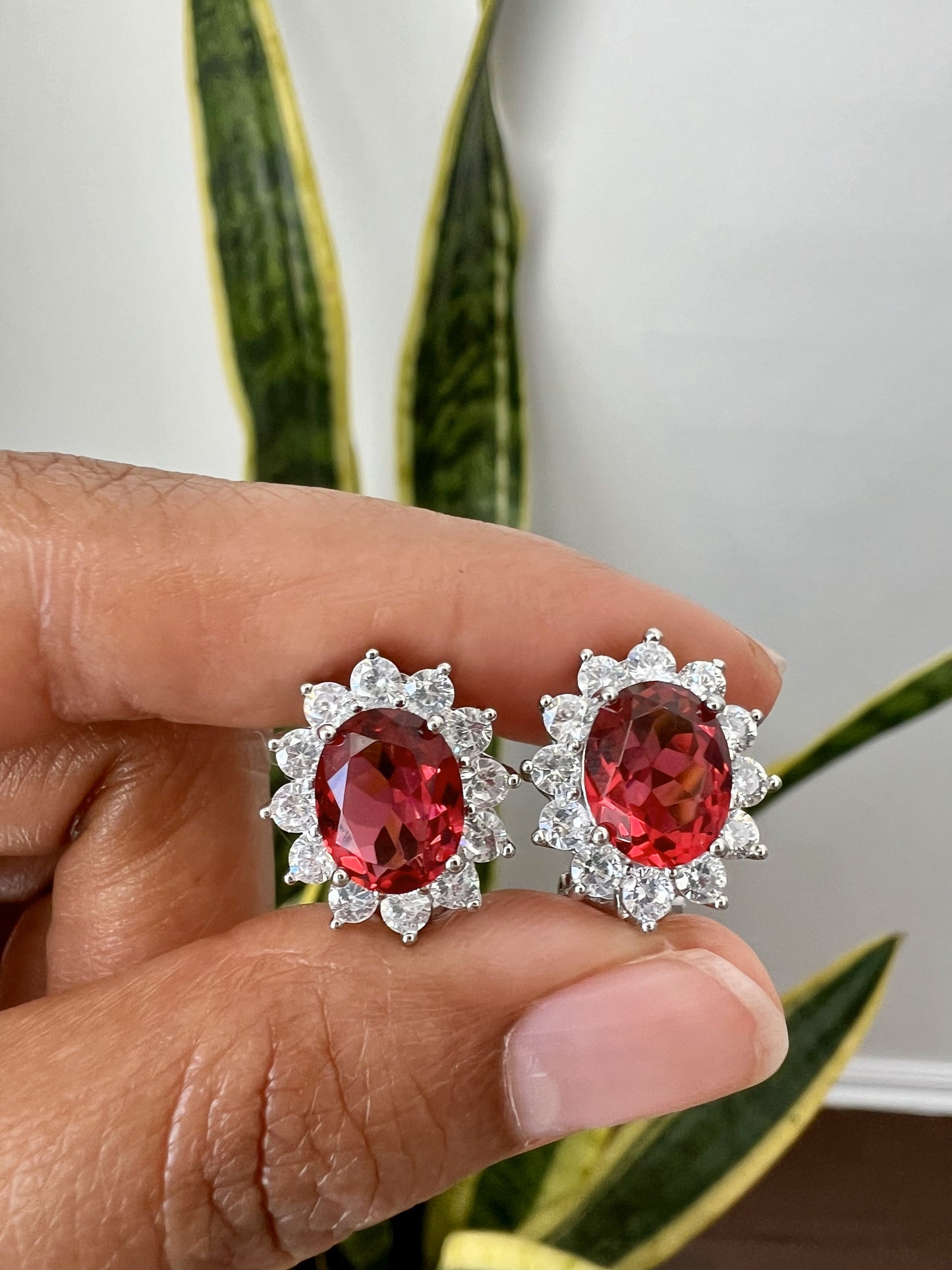 Ruby Oval Solitaire with Round Cut Diamond Cluster Studs