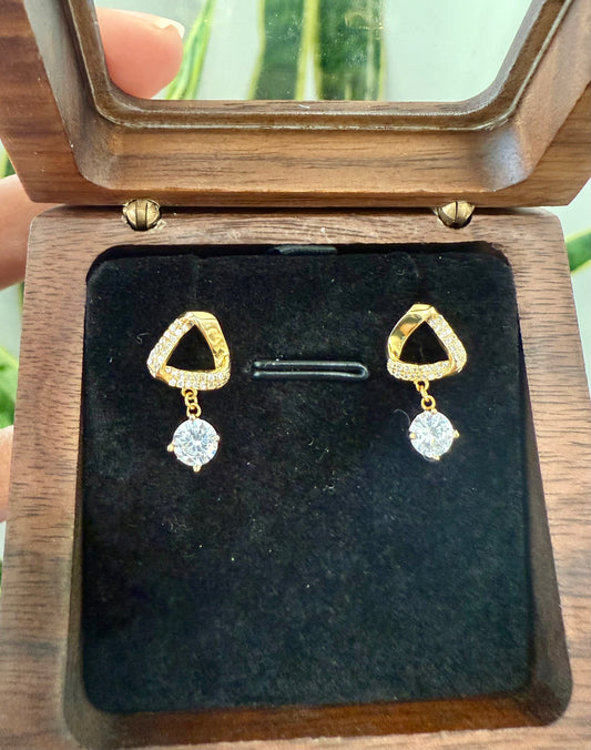 Triangle shaped studded earrings with hanging diamonds
