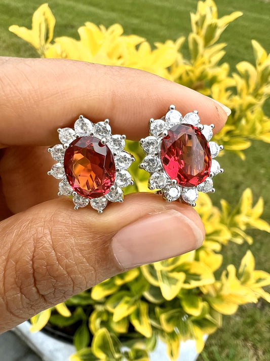 Ruby Oval Solitaire with Round Cut Diamond Cluster Studs