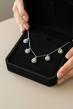White Gold Finish Drop and Round Cut Solitaire Charms Necklace on pure 925 Silver